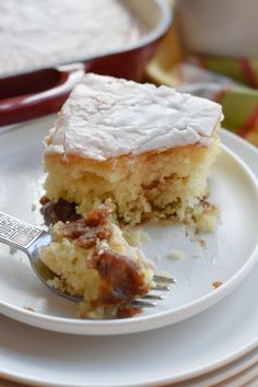 a piece of cake sitting on top of a white plate with a fork in it