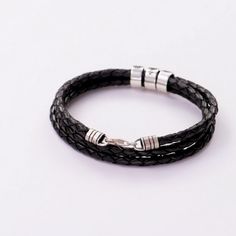 Men's Braided Leather Bracelet with Small Custom Beads in Silver - MYKA Masculine Adjustable Braided Bracelets With Leather Strap, Masculine Adjustable Braided Leather Bracelet, Classic Black Braided Bracelet, Classic Black Braided Jewelry, Handmade Black Leather Braided Bracelet, Adjustable Braided Bracelet With Stainless Steel Clasp, Masculine Adjustable Black Band Bracelets, Masculine Black Band Adjustable Bracelet, Everyday Black Braided Leather Bracelet