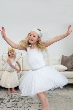 It's irresistible to twirl, jump, and dance in this fun, soft shimmery silver tutu! Ages 3-8 Made with three layers of silver soft tulle that with a knit underskirt and decorated with silver sequins Soft elastic waistband to fit a variety of sizes and ages Breathable, Silky Soft, 100% Polyester Fabrics Accessories Sold Separately White Tulle Tutu Dress For Christmas, White Ballet Tutu Dress For Party, Princess Look, Fabric Crown, Fabric Accessories, Soft Tulle, Silver Sequin, Hook And Loop, Put On