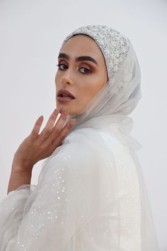 Gorgeous Embroidered Handmade Silver Turban is made with care and love and paired with a 100% Pure Soft Silk Shawl (28"x 72") or a Tulle Shawl (27"x72") for a more dramatic glimpse. You have the option to choose the look you’re looking for. This Silver Glow Set is perfect for an extremely elegant and royal look on your special occasions. Whether it’s for your wedding or engagement party it will add the wow factor to your look. Even if you decided to wear it as a bridesmaid or just for attending Hijab Magnets, Tulle Shawl, Bride Hijab, Hijab Veil, Gold Glow, Muslim Brides, Royal Look, Silk Shawl, Handmade Gold