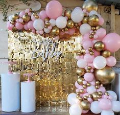 a pink and gold birthday party with balloons