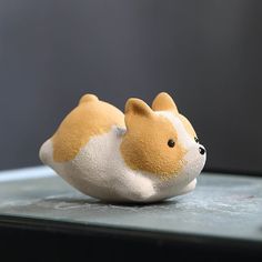 a small stuffed animal sitting on top of a table