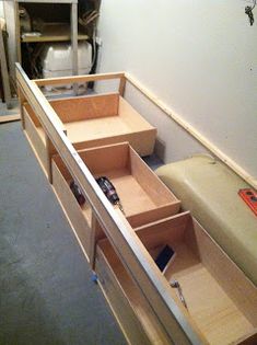 the drawers are open and ready to be put into the wall in the storage area