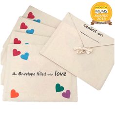 four envelopes with hearts on them and the words sealed out written in black ink