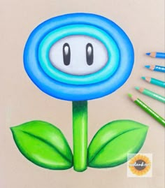 a drawing of a blue flower with green leaves on it and two crayons next to it