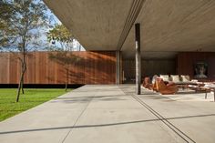 an outdoor living area with couches and tables