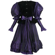 Resurrection Vintage is excited to offer a vintage Yves Saint Laurent purple taffeta ensemble featuring a button front jacket with black velvet paneling in the front and back, purple puffed sleeves, and a matching purple taffeta skirt with a ruffle flounce at the hem. Circa 1982. Yves Saint Laurent Size 40 Measurements: Bust 34in, Waist 28in, Hips Free. Silk Taffeta and Velvet Excellent Vintage Condition Authenticity Guaranteed Taffeta Skirt, Vintage Yves Saint Laurent, Silk Taffeta, Royal Purple, Ruffle Skirt, Black Velvet, Yves Saint Laurent, Victorian Dress, Evening Dresses