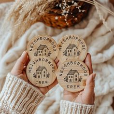 two wooden coasters with the words neighborhood crew on them