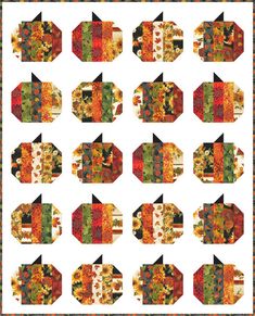 an image of a quilted table topper with autumn leaves and pumpkins on it