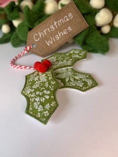 a green christmas ornament sitting on top of a table