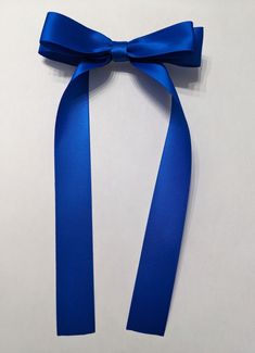 a blue ribbon with a bow on it