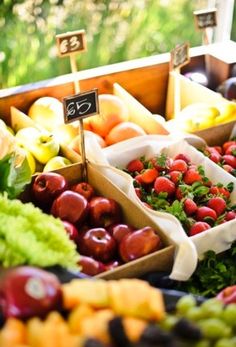 an assortment of fresh fruits and vegetables on display