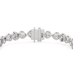 A tennis bracelet with a floral motif, perfect for the romantic at heart. Showcasing a pattern of tulips, it features a combination of marquise and princess-cut diamonds on elegant V-prongs, and bezel-set heart-shaped diamonds. With a touch of nature's beauty, this diamond bracelet is bound to give your looks a dreamy and modernly feminine finish. Elegant Diamond Heart Bracelet With Brilliant Cut, Luxury Marquise Cut Bracelets For Anniversary, Marquise Diamond Bracelet In White Gold For Anniversary, White Gold Marquise Diamond Bracelet For Anniversary, Anniversary White Gold Diamond Bracelet In Marquise Shape, Diamond White Marquise Tennis Bracelet For Anniversary, Silver Marquise Diamond Bracelet For Anniversary, Elegant Heart-shaped Brilliant Cut Diamond Bracelet, Silver Marquise Jubilee Tennis Bracelet