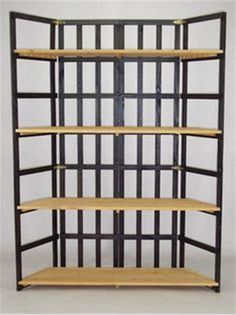 a wooden shelf with metal bars on the top and bottom shelves in front of it