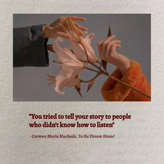 a hand holding a flower with the quote you tried to tell your story to people who didn't know how to listen