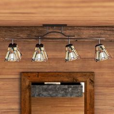 a bathroom vanity with five lights and a mirror