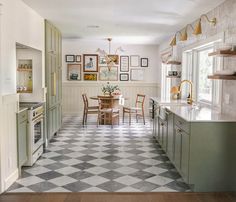 the kitchen is clean and ready to be used for dinner or lunch time, as well as family photos on the wall