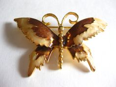 Marked AAi, pretty enamel butterfly brooch, enamel and gold tone.  In good vintage condition. Vintage Brown Brooches For Gifts, Gold Butterfly Brooches For Collectors, Vintage Butterfly Brooch For Formal Occasions, Retro Gold Enamel Brooches, Vintage Gold Enamel Brooches, Gold Butterfly Brooch Gift, Gold Butterfly Brooch As Gift, Gold Butterfly Brooch For Gift, Gold Butterfly Brooches For Gift