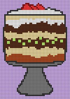 a cross stitch cake on top of a plate with chocolate frosting and sprinkles