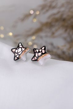 Shining star earrings made with rose gold mirror foil. Diameter : 0.63 x 0.63 in / 16 x 16 mm Earrings are made on a epoxy resin base with epoxy finish on top.  They have stainless steel posts. Very small and lightweight.  Perfect for a birthday gift, anniversary gift, back to school gift. If you have any questions, feel free to send me an etsy message. For more of my work visit my shop : https://www.etsy.com/shop/TikoloByTijana Come and say hi on Instagram : www.instagram.com/tikolobytijana Rose Gold Star Jewelry For Parties, Rose Gold Star-shaped Party Jewelry, Rose Gold Star Charm Earrings, Rose Gold Star Earrings With Star Charm, Rose Gold Star-shaped Earrings With Star Charm, Rose Gold Star Earrings For Gift, Rose Gold Earrings With Star Charm As A Gift, White Star-shaped Earrings As Gift, Mosaic Star