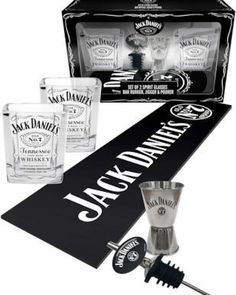 the jack daniels shot glass set includes two shot glasses and an old fashioned bar tool