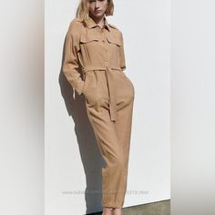 Nwt And With Defects. -*****Missing Belt *** Buttons Closure. Flap Pockets Shoulder: 17” Bust: 19” Waistband: 19” Rise: 14” Inseam: 27” Color: Camel Zara Long Sleeve Jumpsuits And Rompers For Fall, Zara Long Sleeve Jumpsuits For Fall, Elegant Zara Jumpsuits And Rompers With Pockets, Beige Jumpsuits And Rompers For Fall Workwear, Beige Fall Jumpsuits And Rompers For Work, Casual Beige Pantsuit For Spring, Zara Long Sleeve Jumpsuit For Work, Spring Beige Pantsuit With Pockets, Zara Beige Jumpsuits And Rompers For Work