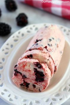 a white plate topped with ice cream and berries