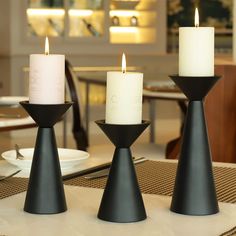 PRICES MAY VARY. Measurements: Fit for 2" dia pillar candles. Small-3.15"L x 3.15"W x 5.3"H; Medium- 3.15"L x 3.15"W x 6.22"H; Large- 3.15"L x 3.15"W x 7.8"H. Package include: Set of 3 pillar candle holder set, candles are not included An industrial inspired design provides a reclaimed feel to your home with a sophisticated comfort This versatile set of candle holders are crafted with solid iron material, Each candle holder features a textured matte black finish These iron candle holders set com Pillar Candles Fireplace, Black Candlestick Holders, Metal Candle Stand, Black Pillar Candles, Black Candle Holders, Iron Candle Holders, Black Candle, Iron Candlesticks, Standing Candle Holders