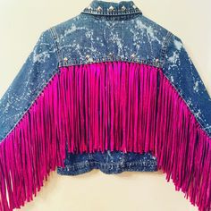 Bleached and distressed denim jacket with fuchsia fringe down arms and back adorned with silver studs.  Arm only fringe is also available Jean Rose, Trajes Country, Customised Denim Jacket, Fringe Clothing, Festival Jacket, Diy Jacket, Ropa Diy, Fringe Jacket, Distressed Denim Jacket