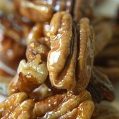 several pieces of pecans are stacked on top of each other with caramel drizzle