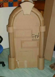 a cardboard arch sitting on top of a desk