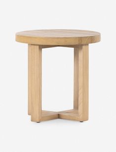 a small round wooden table with one leg bent down and the other end turned backwards