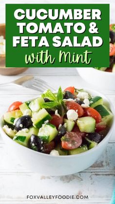 cucumber, tomato and feta salad with mint in a white bowl on a wooden table