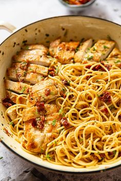 pasta with chicken and sauce in a pan