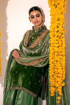 Traditional Green Mehndi Dress in Royal Kameez Gharara and Dupatta Style is Adorned with Beautiful embroideries, Sequins, Tilla, and Dabka. Fast shipping. Green Kameez, Velvet Kameez, Pakistani Mehndi Dress, Pakistani Bridal Lehenga, Latest Bridal Lehenga Designs, Wedding Dresses Pakistani, Pakistani Mehndi, Bridal Mehndi Dresses, Mehendi Outfit