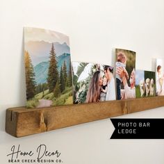 a wooden shelf with pictures on it