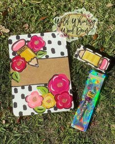 an assortment of crafting supplies laying on the grass