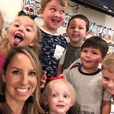 a group of children and an adult posing for a photo