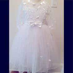 Sequins Dress With Bow In The Front And Bow In The Back White Princess Tutu Dress For Confirmation, Spring Princess Tutu Dress For Confirmation, Princess Style First Communion Summer Dress, Princess Style Summer Dress For First Communion, Princess Style Summer First Communion Dress, White Princess Tutu Dress For First Communion, White Fitted Princess Dress For Dress-up, White Dress For First Communion In Spring, Fitted White Tutu Dress For Confirmation