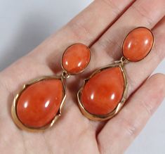 -Vintage 14k Gold Natural Japanese Momo Orange Red Coral Earring -Total length: 2 in -Round coral size: 16.5 mm x 12.4 mm -Tear drop coral size: 24.65 mm x 17.5 mm x 7.6 ( thickness ) -Total weight: 17.9 g -Tested 14k Vintage Style Single Strand Red Coral Jewelry, Gold Red Coral Round Jewelry, Vintage Single Strand Red Coral Jewelry, Scarab Bracelet, Hand-strung Round Red Coral Jewelry, Red Coral Earrings, Coral Design, Coral Earrings, Jade Pendant