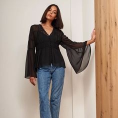 Romantic Yet Edgy, This Left Bank Blouse Is Just At Home In Your Living Room As It Is Navigating Busy Avenues. With A Removable Cami And Functional Button-Front The Styling Possibilities Are Endless. Wear It With Jeans And Boots Or Dress It Up With A Wide Leg Trouser Like Our Cadet Pant -100% Silk Georgette, Camisole100% Polyester -Tiered Blouse With Shirred Panels, Flares Out Towards Bottom -Removable Camisole, Functional Button Front (Top Seven Buttons Designed To Be Worn Open) -Sleeve Is Slim Black V-neck Blouse With Sheer Sleeves, Black V-neck Tops With Sheer Sleeves, Black Sheer Feminine Top, Feminine Black V-neck Blouse, Black V-neck Top With Sheer Sleeves, Feminine Black Blouse For Date Night, Striped Cami Tops, Tiered Blouse, Georgette Tops