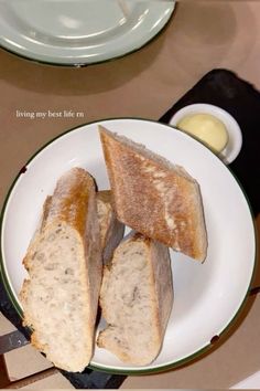 two pieces of bread on a plate with butter