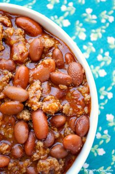 crock - pot sweet chili in a white bowl on a blue and green tablecloth