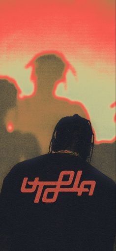 a man with dreadlocks standing in front of two silhouettes