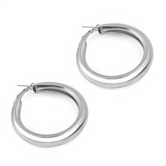 Stay on trend with these gold and silver plated thick hoops. - Care Instructions: Avoid contact with water, lotion, and perfume. Clean gently with a polishing cloth. Product Specifications: - Elegant and versatile design - Hypoallergenic for sensitive ears - Adds a touch of glamour to any outfit Trendy Metal Jewelry With Shiny Finish, Chic Silver Hoop Earrings Tarnish Resistant, Trendy Silver Stainless Steel Hoop Earrings, Lotion And Perfume, Large Hoop Earrings, Chic Boutique, Gold And Silver, Silver Color, Casual Chic