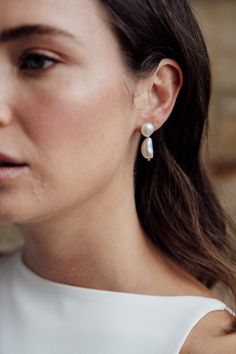 The Nora Mini Drop Earrings feature a mix of two sizes of Baroque Pearls, wired to have an elegant, subtle swing. The perfect understated earrings to wear on your wedding day and beyond. The Nora Drop wedding earrings are designed & hand made in our studio in the UK Measurements: width 1cm | length 2.5cm Baroque Pearls, Gold/Silver plated jewellery wire, Gold filled/ Sterling Silver stud posts and backs As each of our pieces is handmade especially for you, we are unable to accept returns/exchang Pia Arrobio, Pearl Wedding Earrings, Jewellery Wire, Pearl Earrings Wedding, Wedding Earrings Drop, Pearl Hair Pins, Baroque Pearl Earrings, Bridal Earrings Pearl, Earrings Pearl