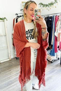 Looking for a stylish and fun way to stay warm this winter? Check out our Open Work Frayed Bohemian Ruana! This cute and cozy wrap is perfect for chilly days and nights, and can be dressed up or down to suit any occasion! #lovemyleto 100% Acrylic Imported Cozy Fringe Outerwear For Fall, Bohemian Shawl For Fall Layering, Cozy Fall Poncho For Beach, Casual Fall Poncho For The Beach, Casual Fall Beach Poncho, Cozy Fringe Cardigan For Fall, Bohemian Fall Outerwear With Tassels, Bohemian Fringe Outerwear For Fall, Oversized Bohemian Outerwear With Fringe