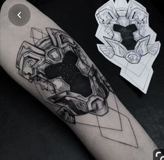 a black and white photo of a tattoo on someone's arm with an abstract design