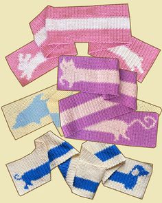 several knitted items are laying on top of each other in different colors and patterns