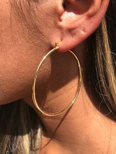 18kt Gold Filled Large Ridged Hoop Earrings Hoop Size: 60mm Width: 2mm Clasp: Hinged Material: 18 Karat Gold Filled, Hypoallergenic. Tarnish Resistant. Gold-filled does not de-laminate or peel like Gold plated Jewelry nor does it tarnish as readily as silver. Generally speaking, gold filled is better quality and will have a much longer lasting color than plated jewelry. We recommend keeping abrasive chemicals away from the jewelry for the items to last. Thank you for visiting and supporting our Hoops Earrings Big, Gold Hoops Large, Large Hoop Earrings Aesthetic, Hops Earrings Gold, Golden Hoops Earrings, Gold Hoops Aesthetic, Gold Hoop Earrings Aesthetic, Big Hoops Earrings, Big Gold Hoop Earrings